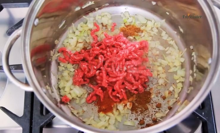 Add spices and beef