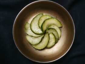Din tai fung cucumber salad recipe result: marinated cucumber slices with sesame in a small metal bowl
