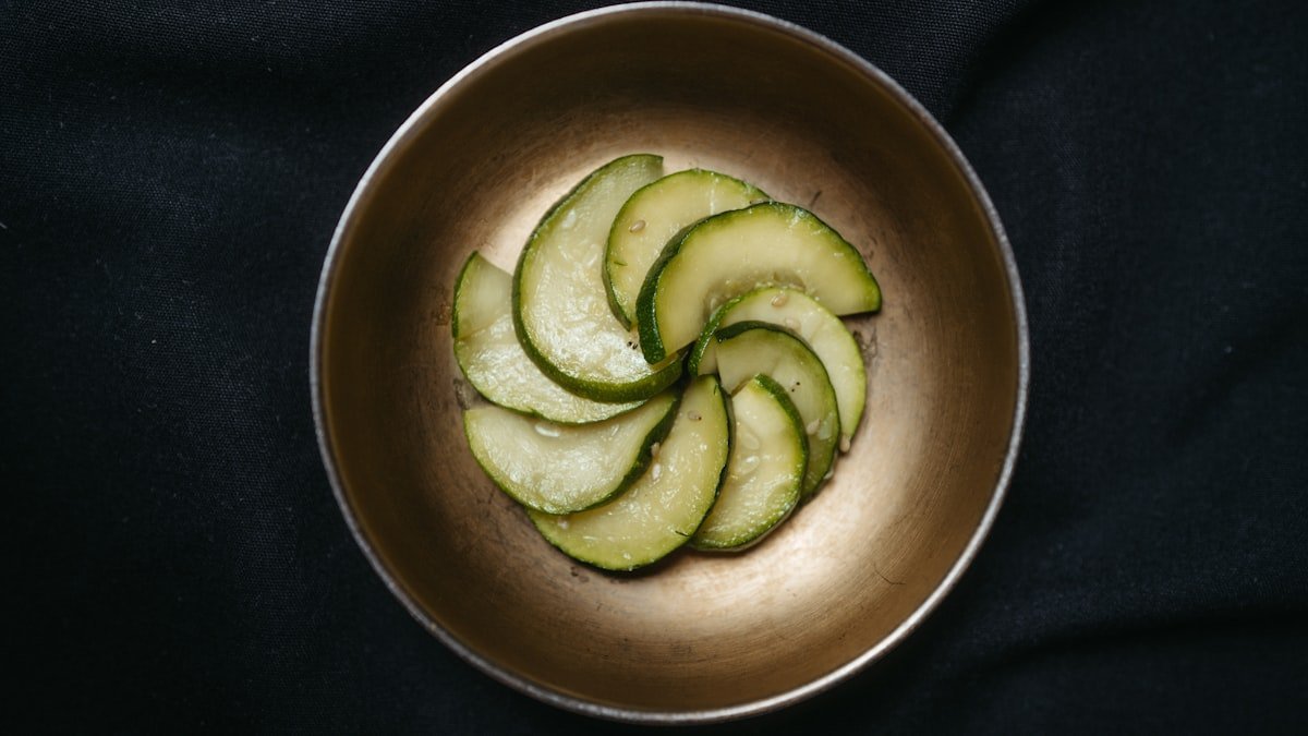 Din tai fung cucumber salad recipe result: marinated cucumber slices with sesame in a small metal bowl