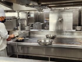 Chef working the line in a licensed commercial kitchen, the kind of space a commissary kitchen rents out