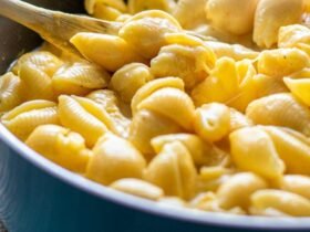 Panera mac and cheese recipe at home: shell pasta in a creamy white cheddar sauce in a skillet